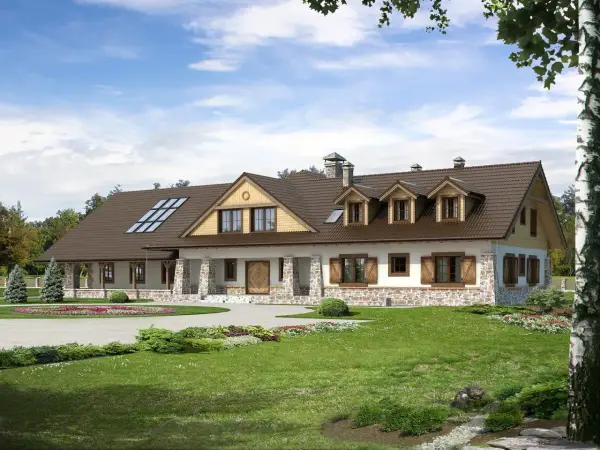Projekt pensjonatu 10 pokoi. Dom z kamienną podmurówką, brązowym dachem i werandą. Otoczony zielenią, z podjazdem.